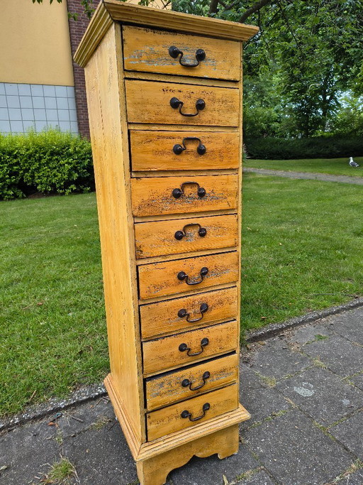 Vintage ochre yellow chest of drawers / apothecary