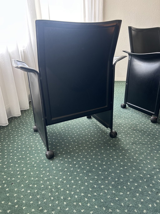 Matteo Grassi 8 pieces of black leather chairs