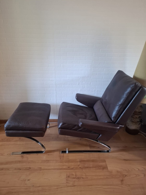 Reinhold Adolf, COR Sinus, (lo Swing) poltrona lounge con pouf (ottoman), Poltrone, Pelle, Cromo, Marrone (foto 2 di 5)