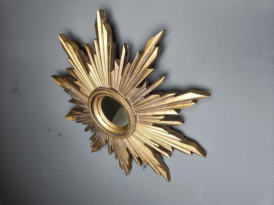Image 1 of Beautiful resin sunburst mirror with convex mirror glass.  The golden mirror is in a good condition.  1960s - made in Belgium.  