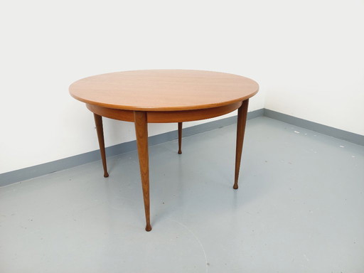 Vintage Scandinavian style round teak dining table from the 1950s/60s with extension