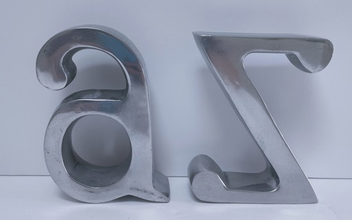 coppia di fermalibri in alluminio pressofuso a forma di "a" e "z"