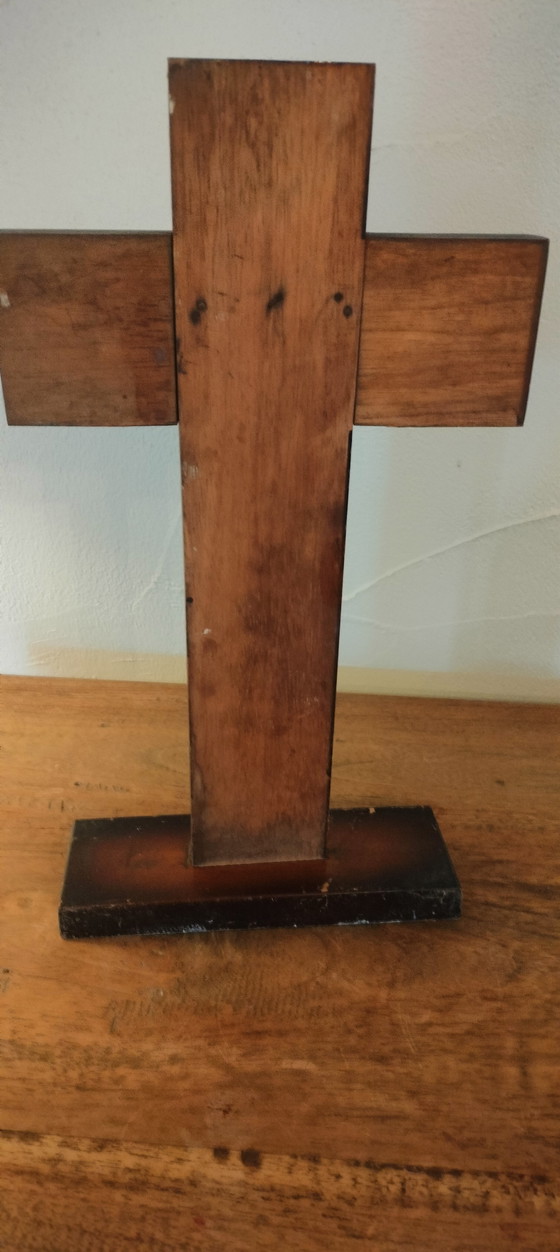 Image 1 of Small copper crucifix on a wooden plank