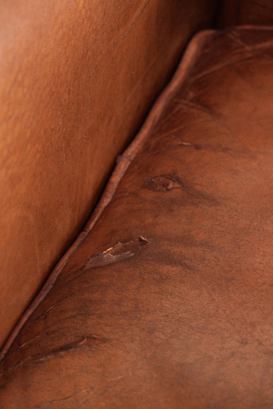 Comfortabele vintage schapenleren armchair afgewerkt met siernagels – Fauteuils, Leather, Klassiek (photo 11 of 12)