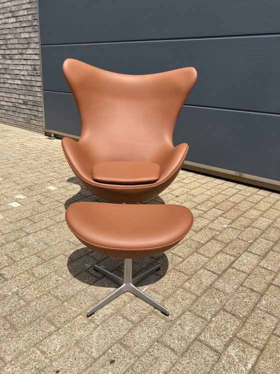 Image 1 of 2x Fritz Hansen Egg Chair + Ottoman en cuir Cognac NEUF !!!