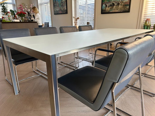 Tavolo da pranzo Leolux Cameleon con 8 sedie in pelle Leolux Spring