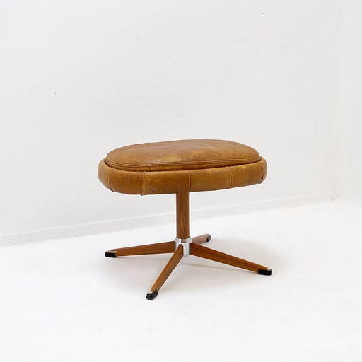 Poggiapiedi girevole in pelle marrone con base in metallo - De Sede, Svizzera.