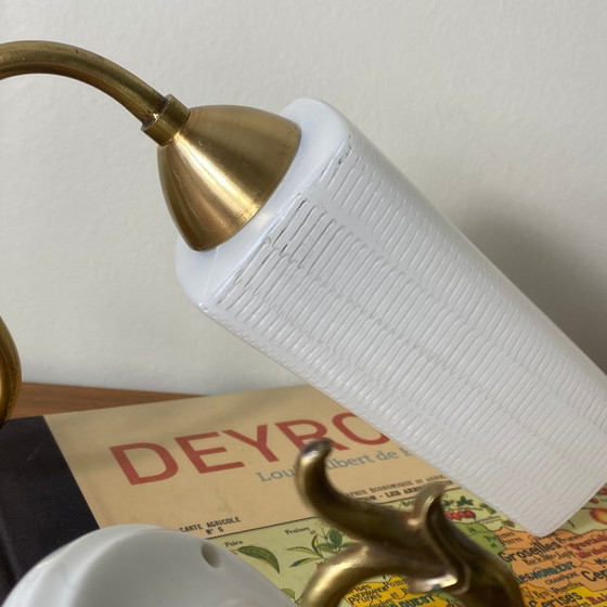 Image 1 of Pair of brass gooseneck wall lights with white glass and porcelain mounting rosettes