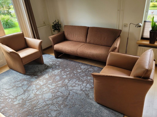 Sofa with two leather armchairs