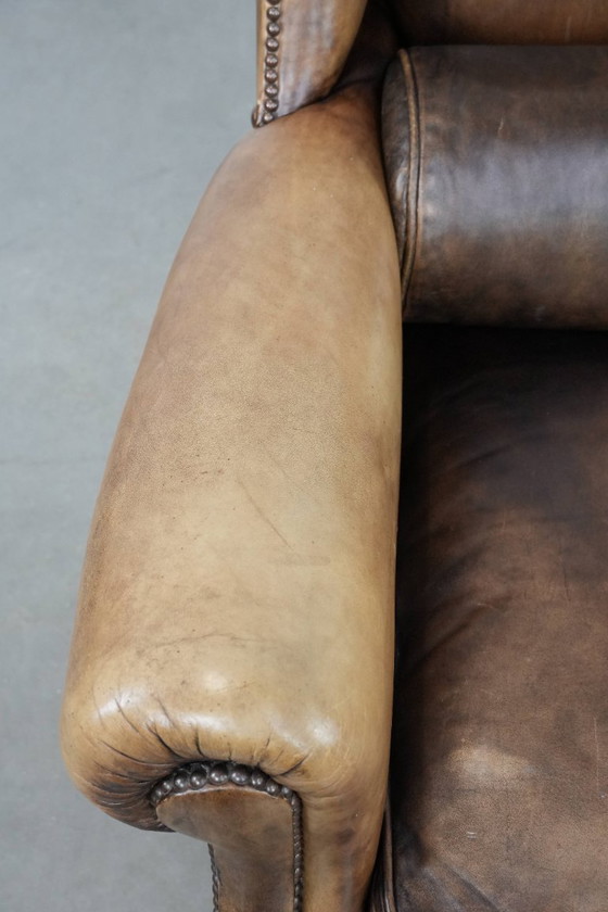 Image 1 of Ohrensessel im englischen Stil aus Kuhfell