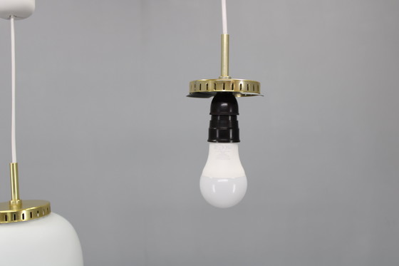 Image 1 of 1970 Karlby Paire de pendentifs en verre opalin et laiton par Lyfa, Danemark