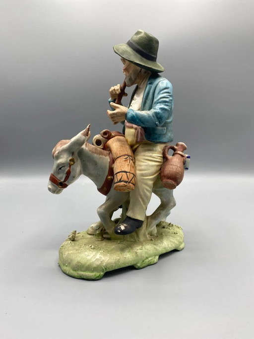 Figurative bisque group, peasant and his donkey loaded with fruit, polychrome, Mediterranean style (photo 2 of 5)