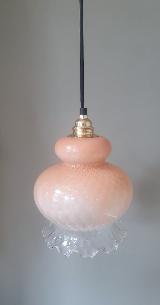 vintage glass floral pendant lamp in pink pastel color with texture. Partly transparent.