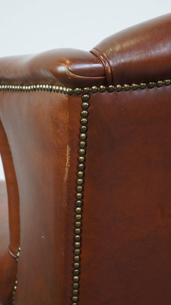 Image 1 of Fauteuil à oreilles en cuir de boeuf