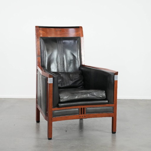 Black cowhide and wooden Art Deco design armchair by Schuitema from the Decoforma series with decorative cushion