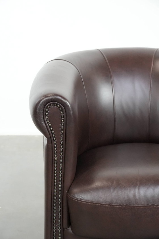 Image 1 of Cowhide club armchair, in very good condition, English style in a brown/dark purple color scheme