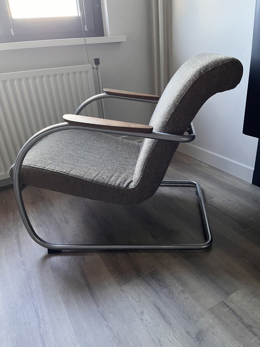Harvink armchair Deining with tubular frame and teak armrest