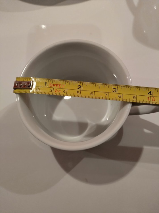 Image 1 of Keith Haring Dinnerware: 3 different sized plates, 1 coffee cup and saucer.