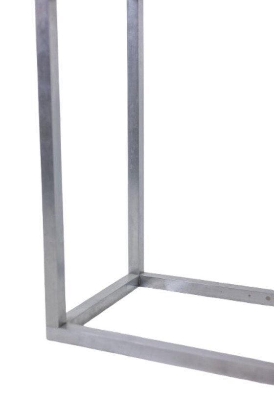 Image 1 of Maison Jansen. Consolle in alluminio spazzolato con piano in vetro verniciato a rovescio. 1970