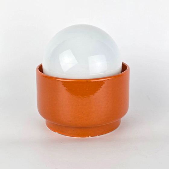 Image 1 of Vintage German ceramic lamp with a glass globe shade. Can be used as a wall lamp, table lamp, or sconce. Orange. 70s / retro