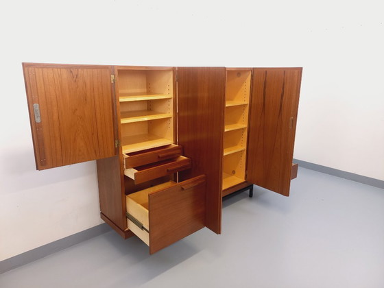 Image 1 of Tall, modernist, vintage Scandinavian sideboard in teak and black metal from the 1960s