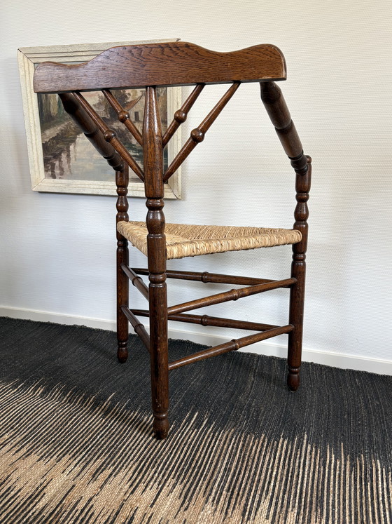 Image 1 of  Vintage Antiek 20ste eeuw eiken hoekstoel met biezen zitting h85cm