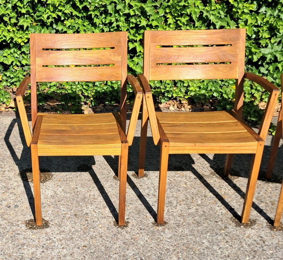 Image 1 of 6 Traditional Teak stacking chairs with armrests