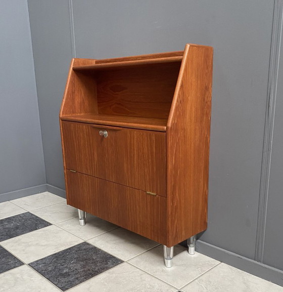 Image 1 of Teak tall sideboard on lucite legs 1960s