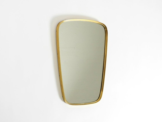 Image 1 of A pair of rare original Mid Century Modern "Münchener Zierspiegel" wall mirrors with heavy brass frames