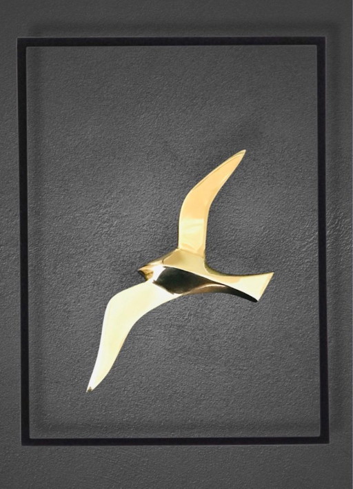 Geometric swallow gilded brass