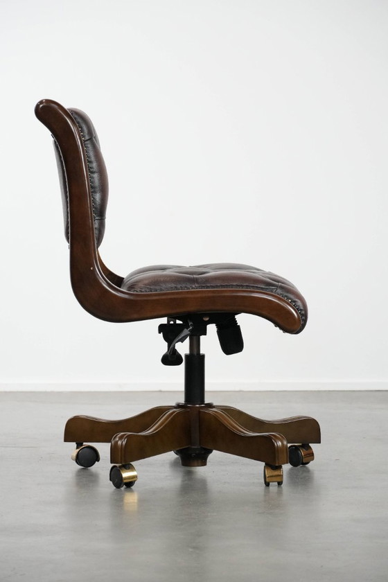 Image 1 of English-style Chesterfield office chair made of cowhide and wood on wheels