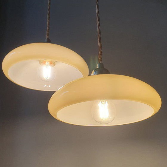 Image 1 of Vintage French pendant lamp set - of pastel yellow opaline glass.