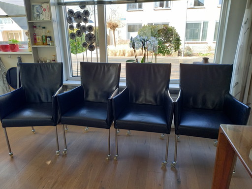 4 Black Leather Chairs On Wheels, Arc By Bert Plantagie