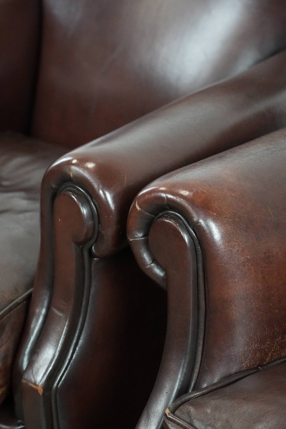 Image 1 of 2 x Schaffellsessel mit zeitlosem Look und wunderschönen dunklen Farben