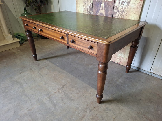 Image 1 of Antique English writing desk, desk with drawers and inlaid leather.

Dimensions 150x90cm and 76cm high.