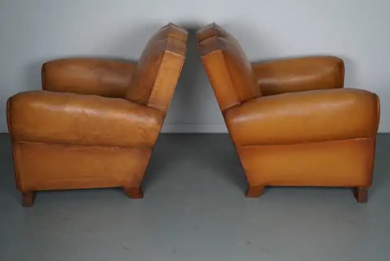 Image 1 of Set Franse cognackleurige leren clubfauteuils met ‘moustache’-rugleuning, jaren 1950