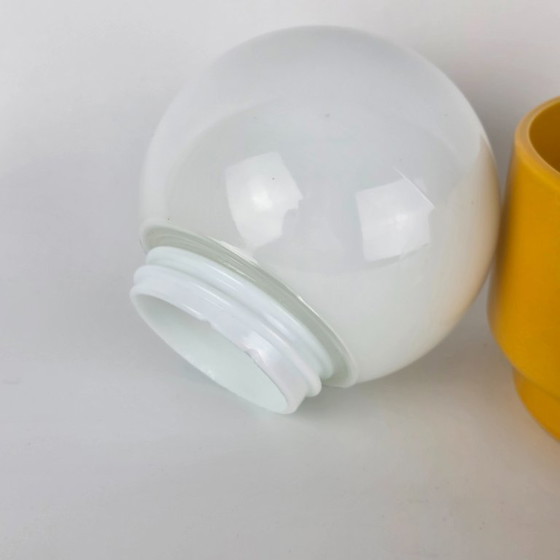 Image 1 of Vintage German ceramic lamp with a glass globe shade. Can be used as a wall lamp, table lamp, or sconce. Yellow. 70s / retro