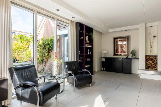 Two Molinari armchairs, Accademia model, black leather