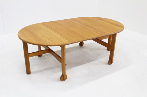 Vintage round extendable dining table made of solid beech wood