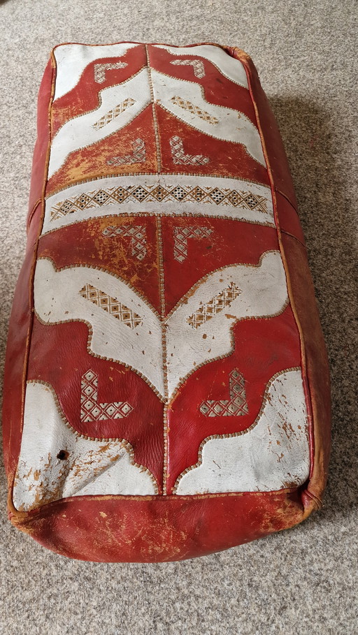 Oriental red/white leather pouf.