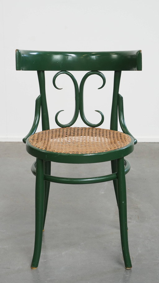 Green Vintage Bistro Chair With A Matted Wicker Seat