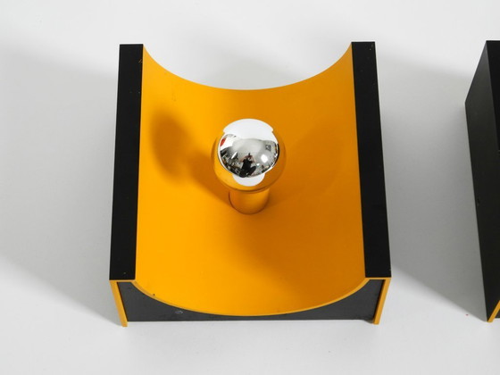 Image 1 of A rare pair of original 1960s Space Age metal wall lamps by Klaus Hempel for Kaiser Leuchten in yellow and black