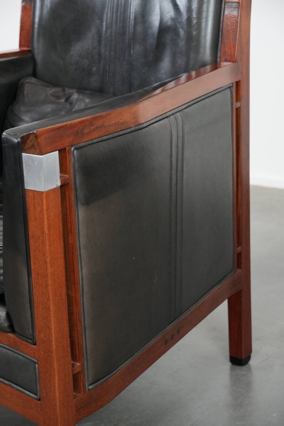 Image 1 of Black cowhide and wooden Art Deco design armchair by Schuitema from the Decoforma series with decorative cushion