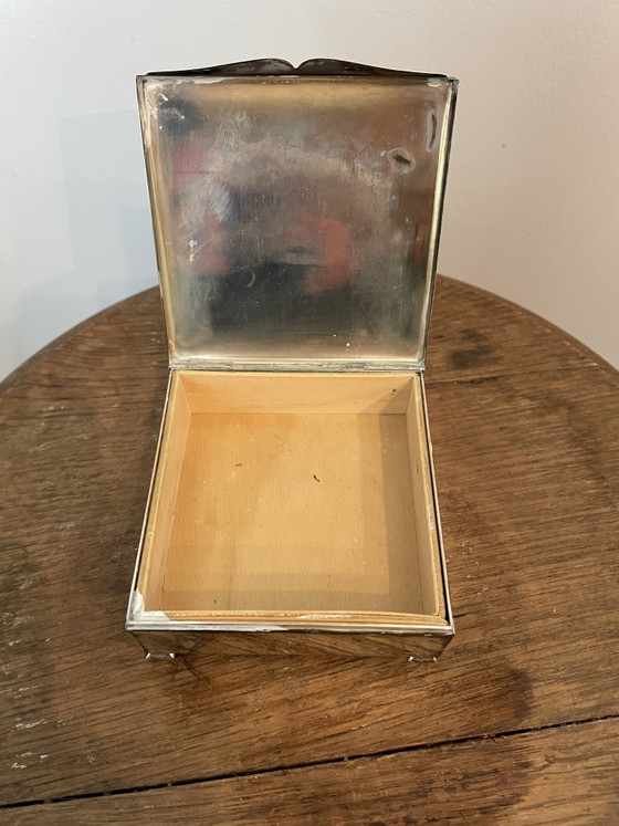 Image 1 of Estuches para cigarrillos y apagavelas, chapados en plata.