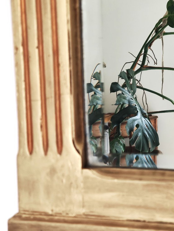 Image 1 of Gilded wooden mirror with carved pediment in the trumeau style