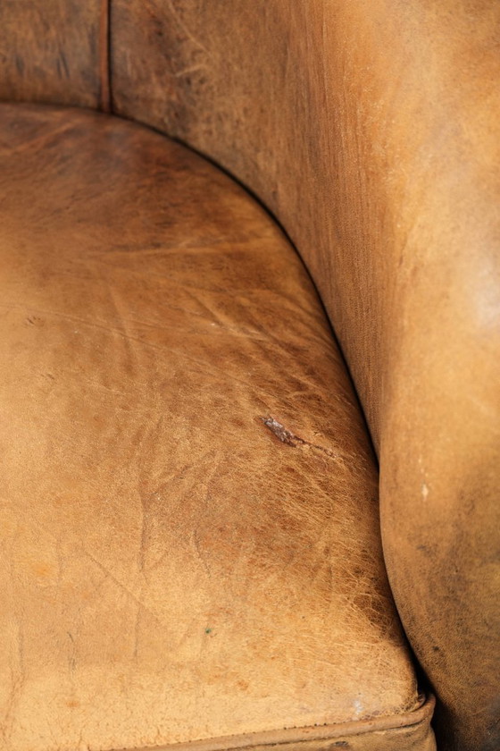 Image 1 of Karaktervolle schapenleren 2 zits bank met een mooie vintage look