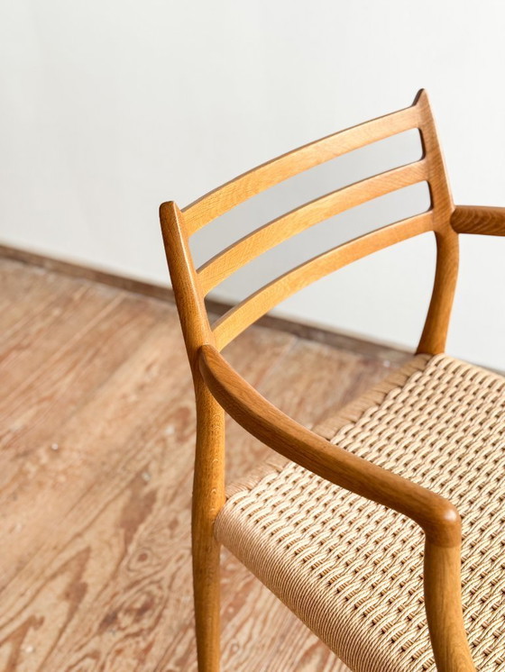 Image 1 of Esszimmerstuhl mit Armlehnen aus Eichenholz, Modell 62 für J.L. Moller