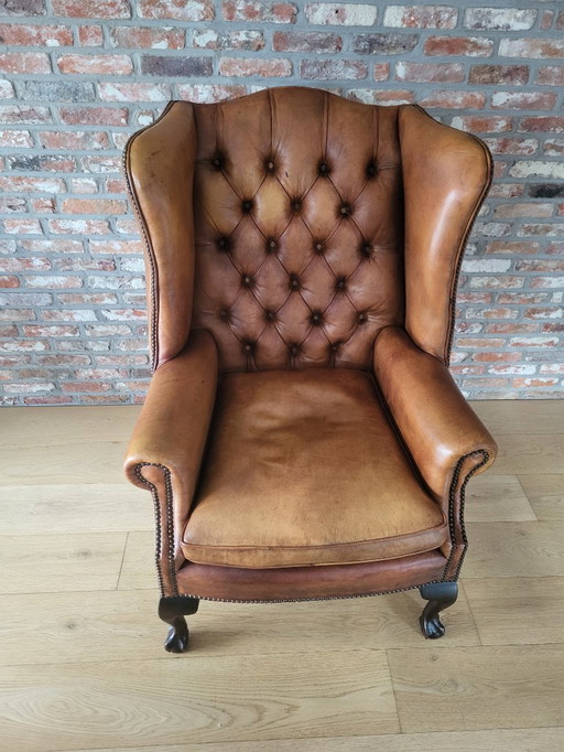 Fauteuil à oreilles de style Chesterfield