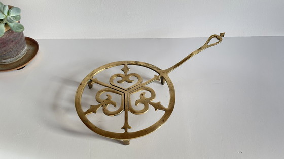 Image 1 of Solid brass trivet