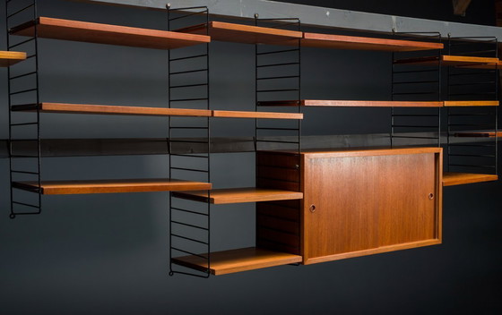 Image 1 of Modulaire wandplank in teak van Nils Strinning voor String, 1960, set van 29